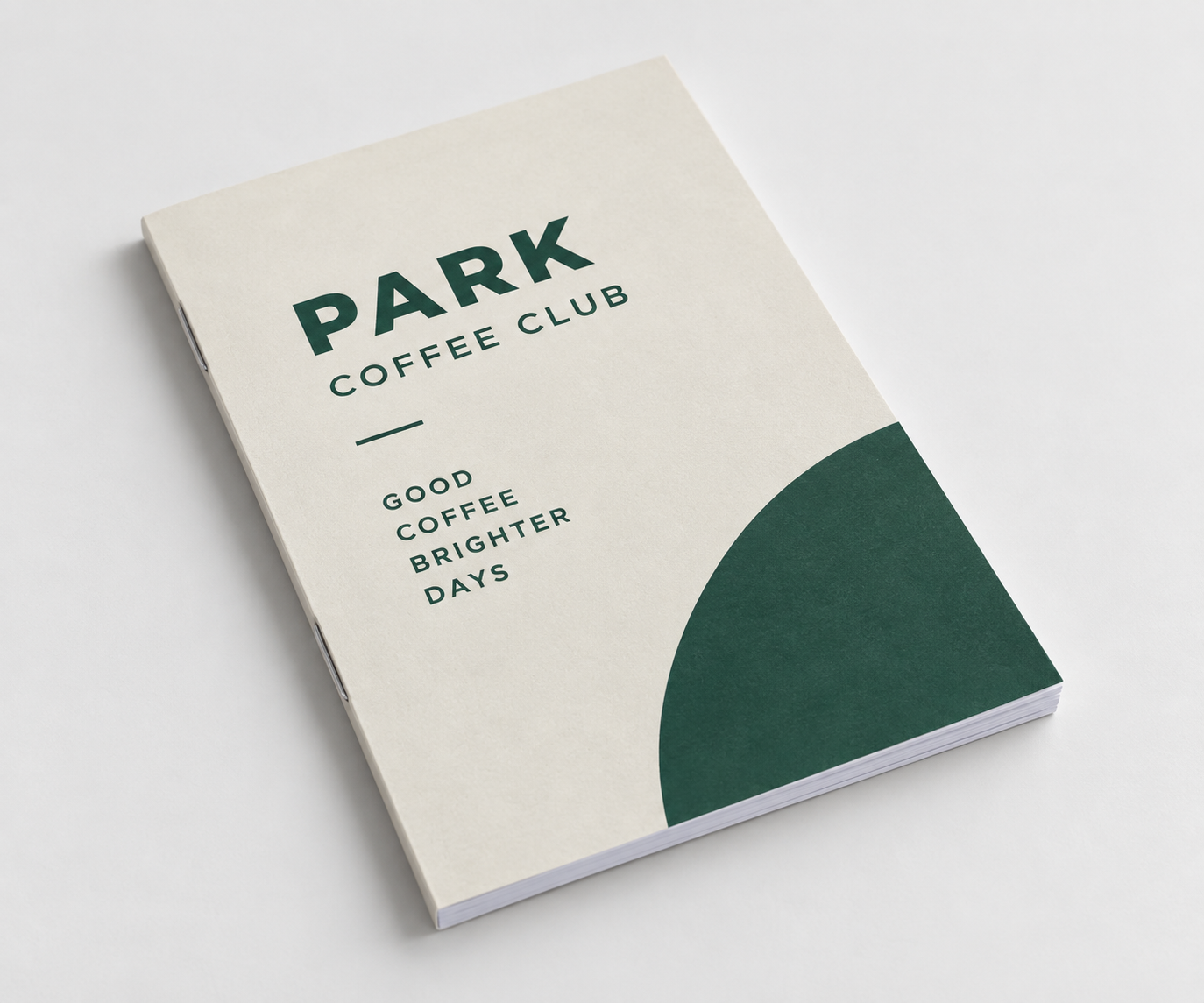 Cream branded notebook with dark green café graphics