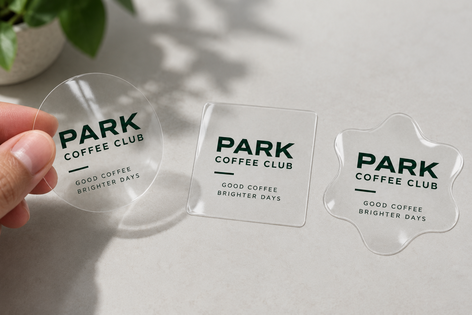 Transparent branded café stickers in round, square and custom flower shapes