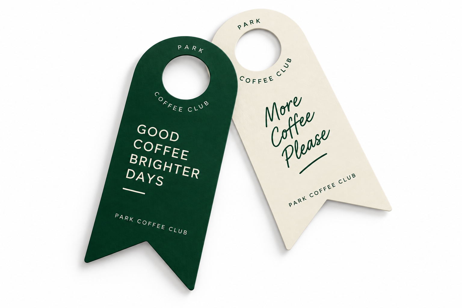 Two branded bottle neck tags in dark green and cream with circular hanging holes